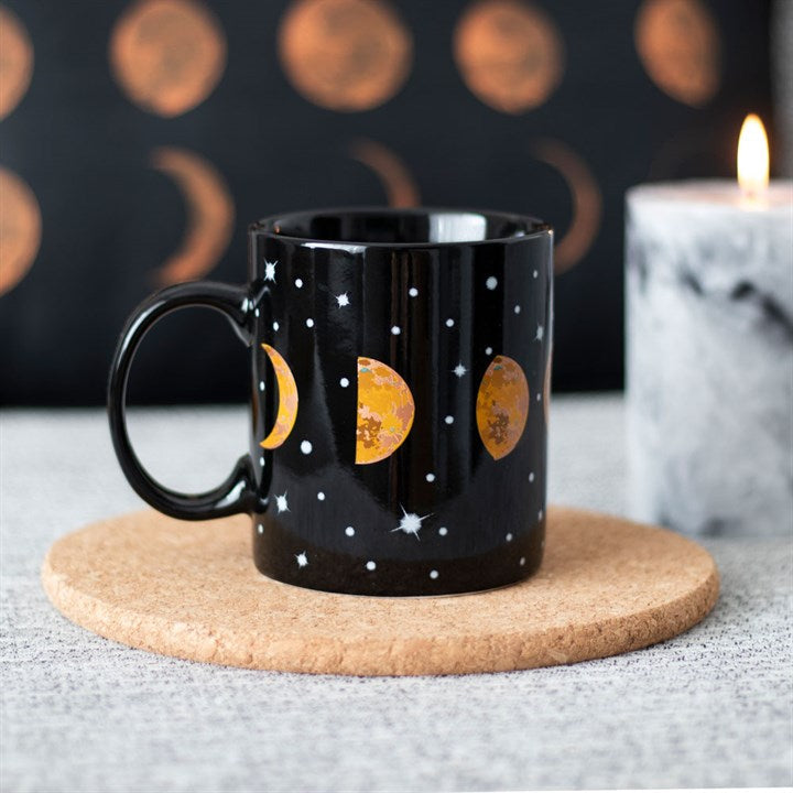 Celestial Magic: Black Ceramic Mug with Moon Phases Design